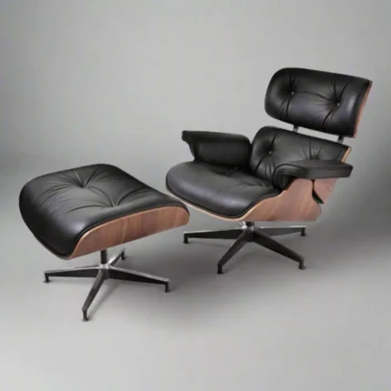 Full front view of the lounge chair charles eames and ottoman set in black aniline leather.